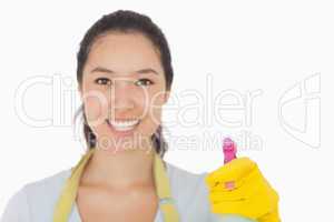 Smiling woman with spray bottle