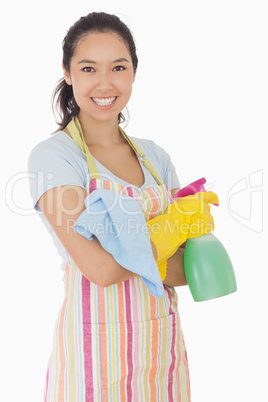 Happy woman holding cleaning products