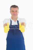 Man in rubber gloves giving thumbs up