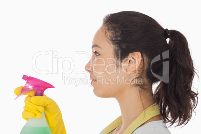 Woman spraying cleaning product