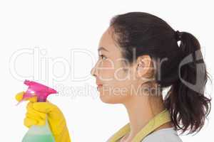 Woman spraying cleaning product