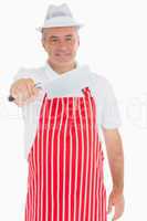 Butcher holding out meat cleaver