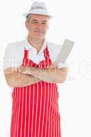 Butcher with arms crossed holding meat cleaver