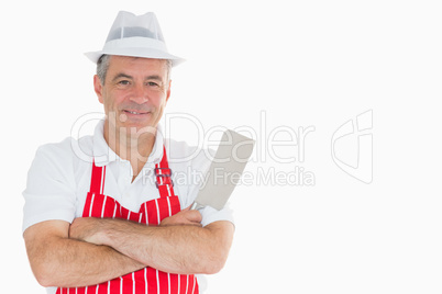Smiling butcher with meat cleaver