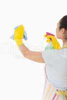 Woman cleaning wall