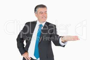 Happy businessman holding out hand