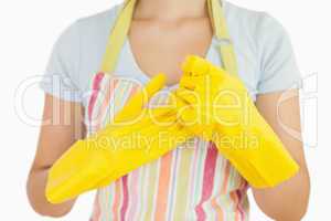 Woman taking off her rubber gloves