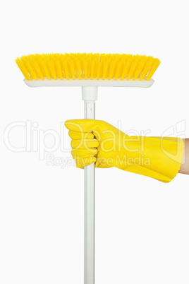 Hand holding broom