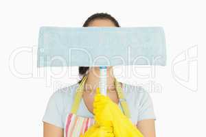 Woman hiding behind dust mop