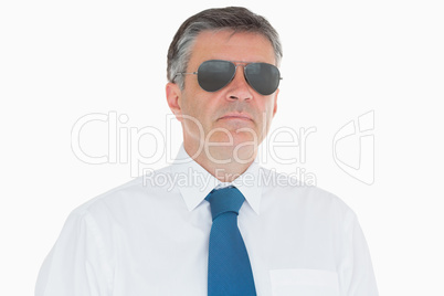 Stern businessman in sunglasses