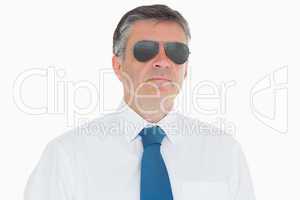 Stern businessman in sunglasses