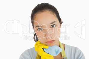 Weary woman holding cleaning rag