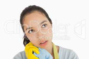 Tired woman clutching cleaning rag