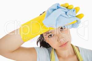 Cleaning woman wiping her brow