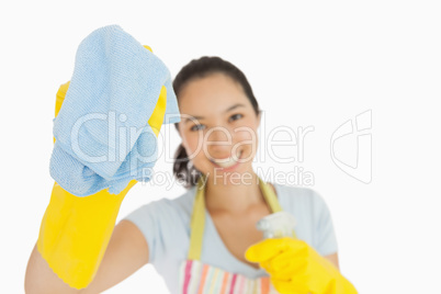 Laughing woman wiping with a rag