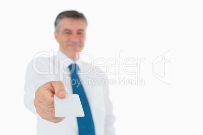 Businessman holding out his card