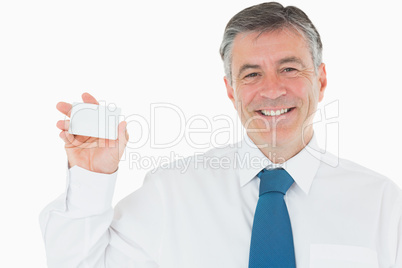 Smiling man with business card