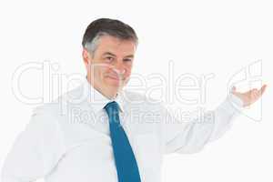 Smiling businessman holding out his hand