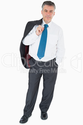 Businessman holding jacket on his shoulder