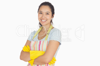 Smiling young woman with crossed arms