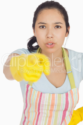 Accusing woman in apron pointing