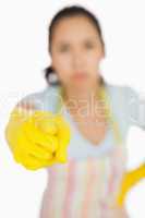 Woman in apron pointing accusingly