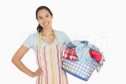 Happy woman with laundry basket