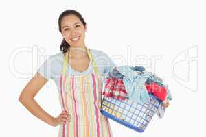 Happy woman with laundry basket