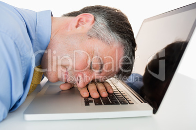 Man sleeping on his laptop