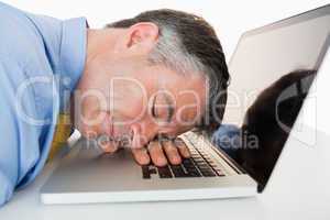 Man sleeping on his laptop