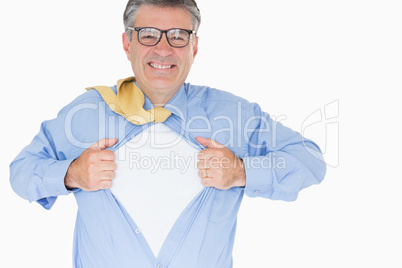 Man with glasses is pulling his shirt with his hands