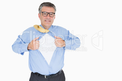 Happy man with glasses is pulling his shirt with his hands