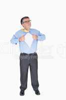 Concentrated man with glasses is pulling his shirt with his hand