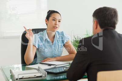 Businesswoman talking with a man