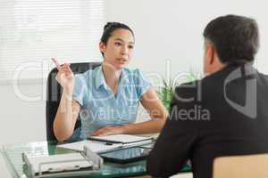 Businesswoman talking with a man