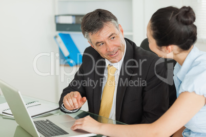 Business man and woman working together