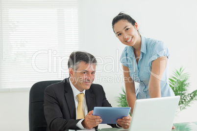 Business man and woman smiling together