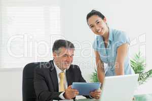 Business man and woman smiling together