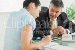 Business man and woman working at table