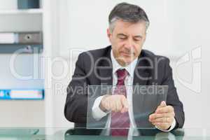 Business man writing something on a virtual screen