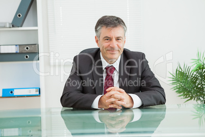 Man smiling in his office