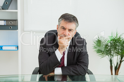 Businessman looking thoughtfully