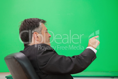 Well-dressed man pointing to a copy space