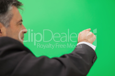 Businessman pointing to copy space