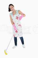 Happy woman sweeping floor