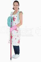 Woman with gloves apron and mop