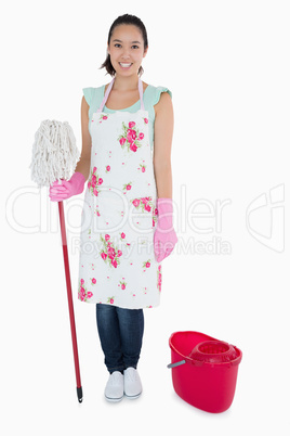 Happy woman with mop and bucket