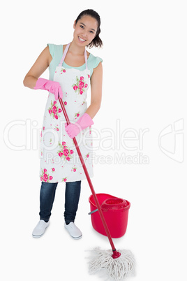 Smiling woman cleaning the floor