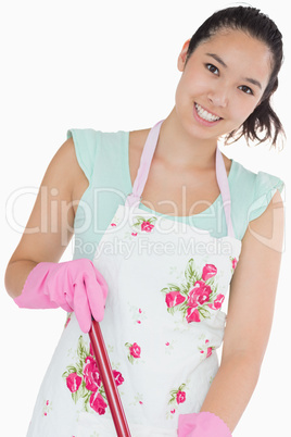 Smiling woman with mop