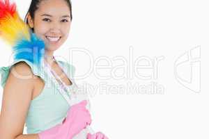 Happy woman with duster